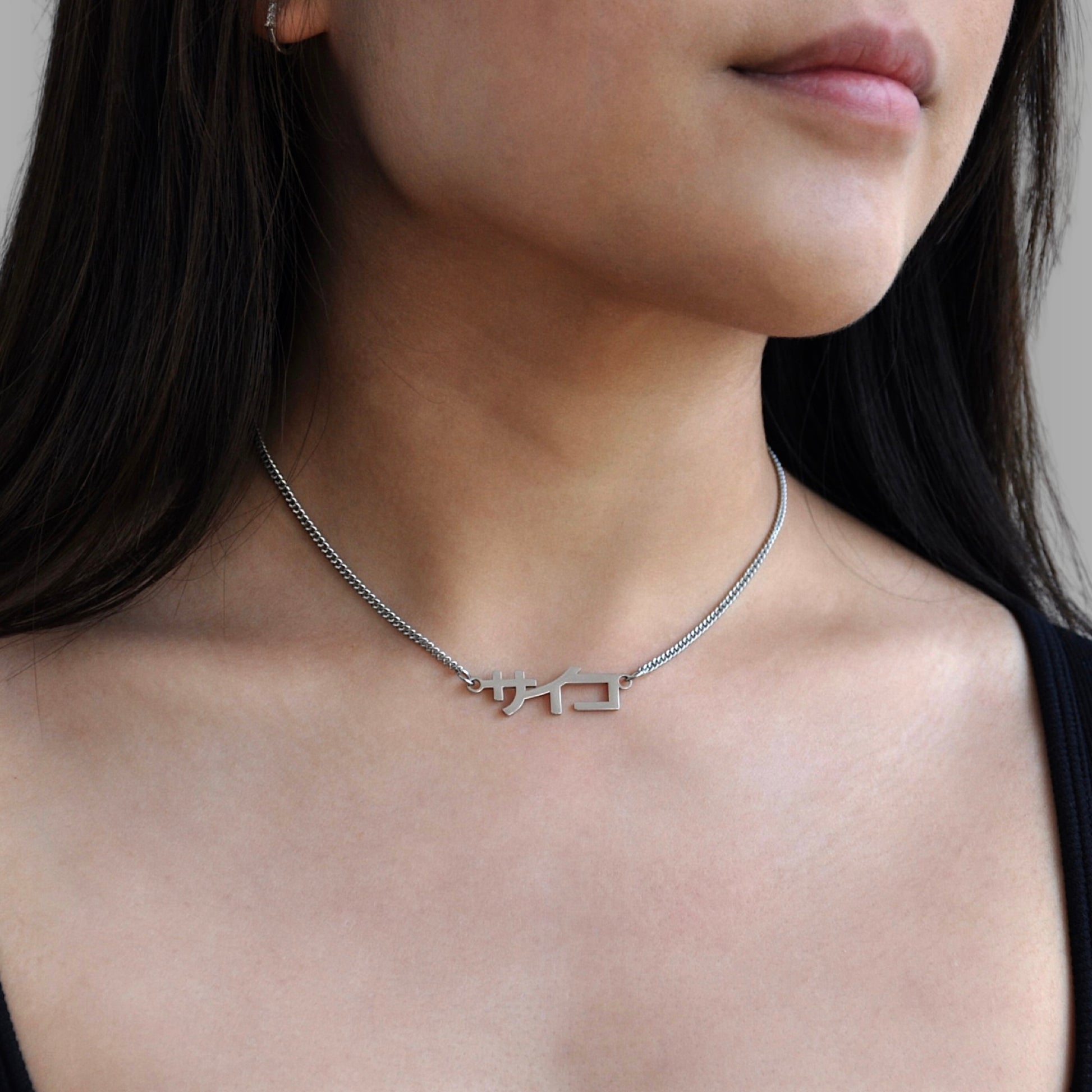 Silver stainless steel 316L necklace worn by a girl