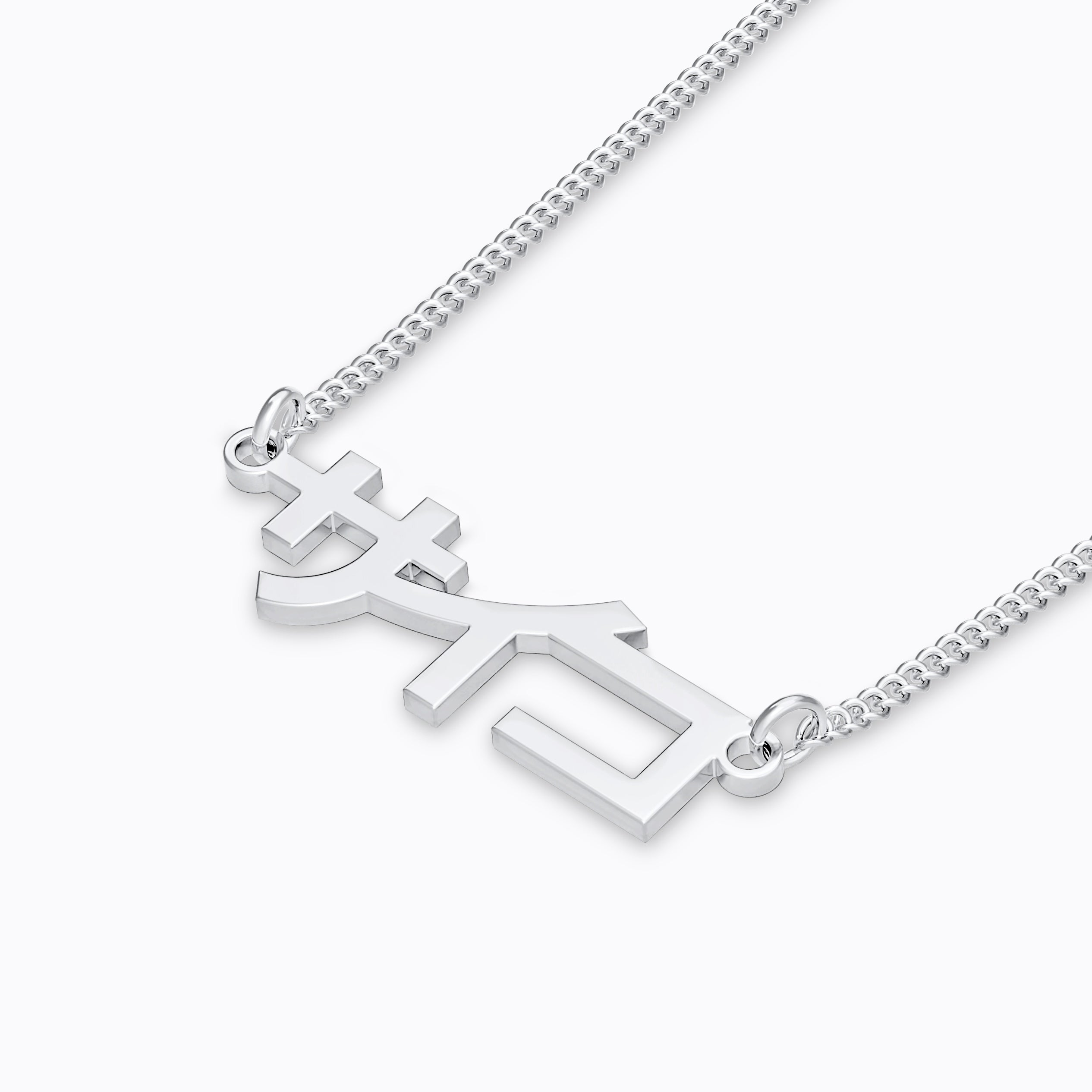 Silver stainless steel 316L necklace placed on the ground with a white background