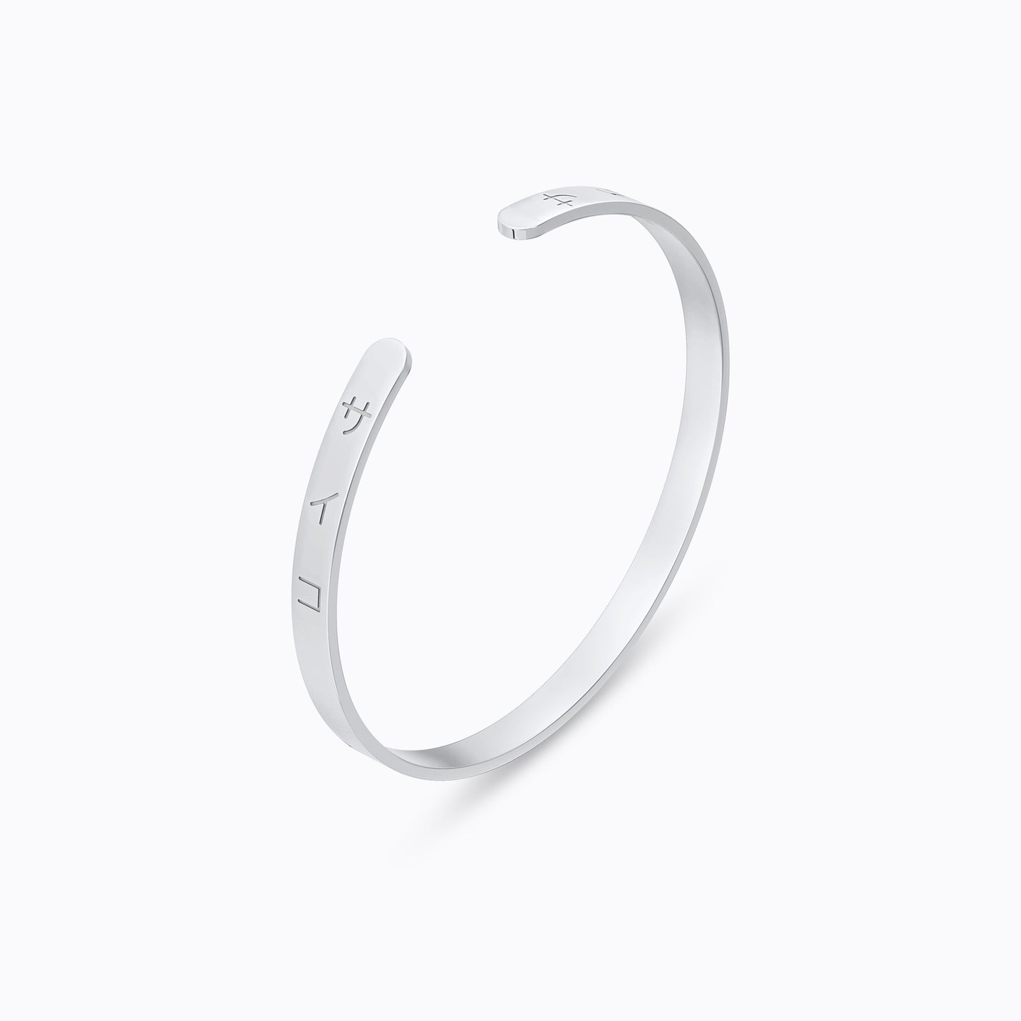 Silver stainless steel 316L cuff bracelet bangle with Japanese SAIKO logo engraved placed on the ground with a white background