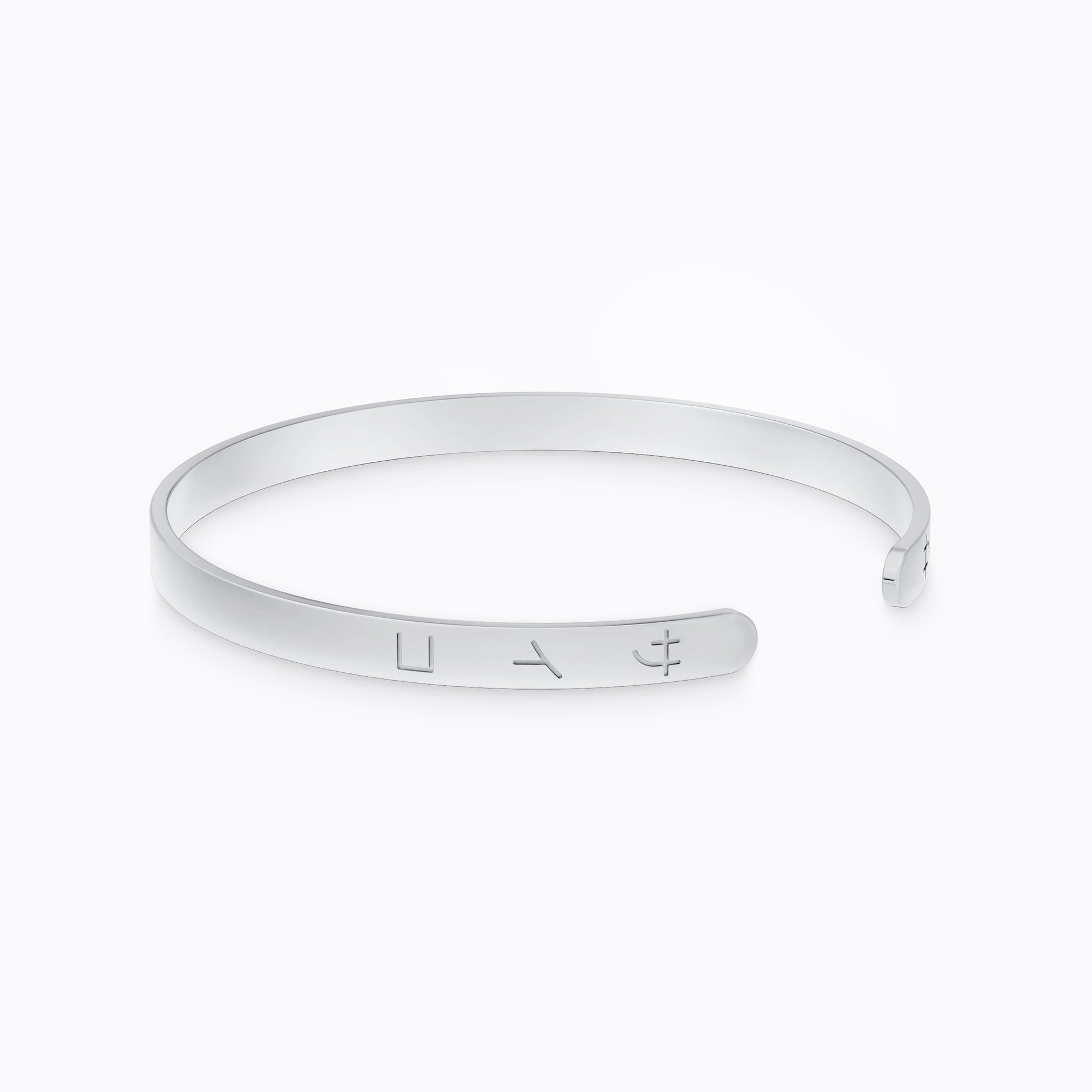 Silver stainless steel 316L cuff bracelet bangle with Japanese SAIKO logo engraved placed on the ground with a white background